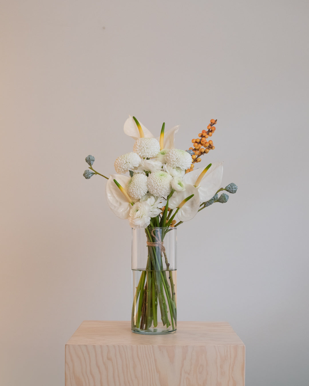 large winter bouquet on a pedestal